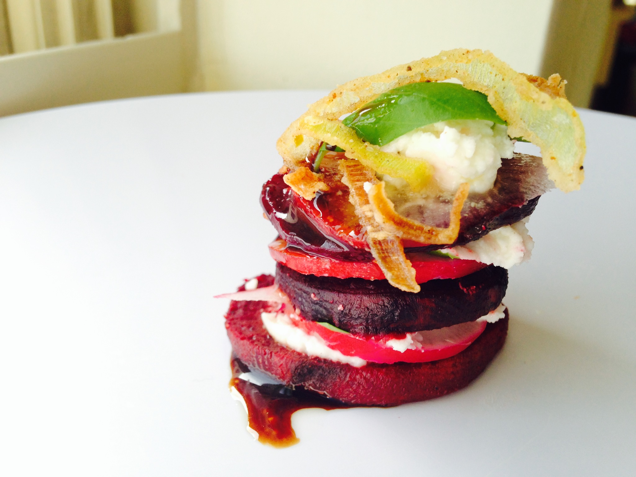 Tip of the Week: Beet Salad Stack with Goat Cheese, Fried Leeks, and Balsamic-Plum Reduction